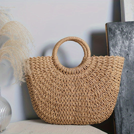SERENELLA | Bolso en forma de media luna de paja trenzada color coñac